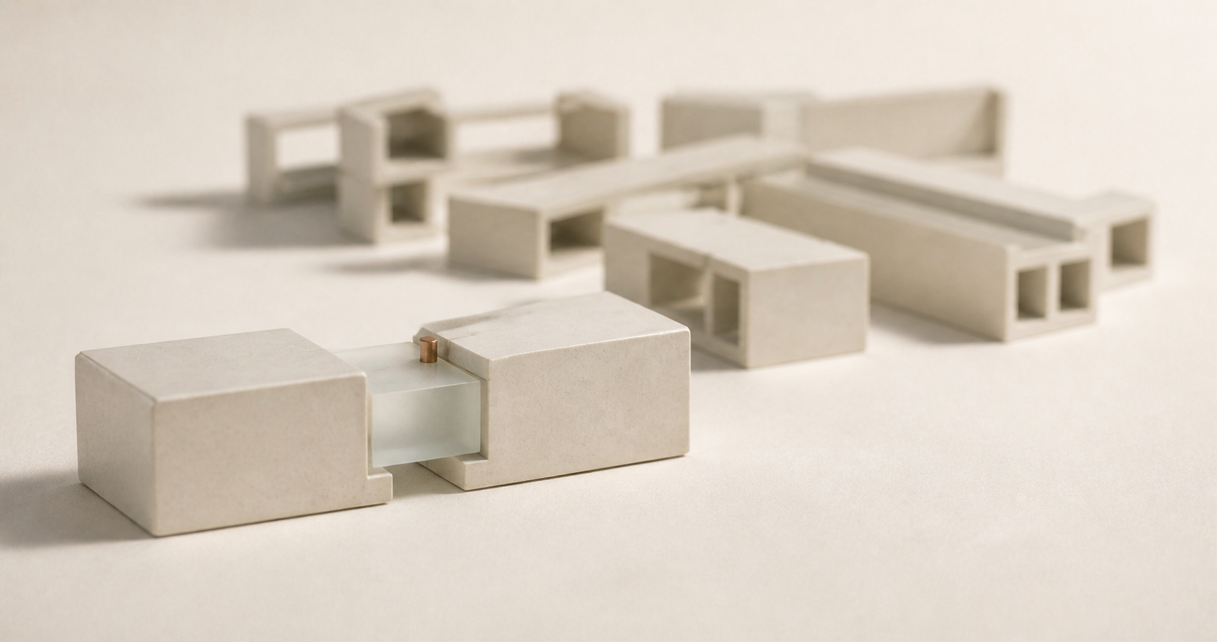 A small translucent module bridging two blocks before a larger unfinished structure.